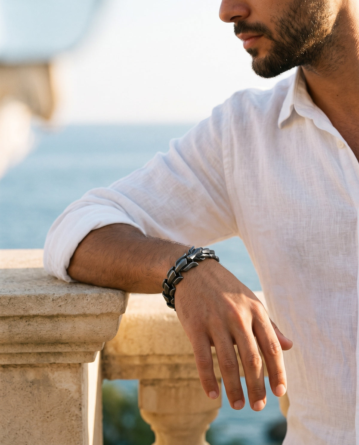 Marco Maveri Titanium Steel Keel Link Bracelet worn with a linen shirt, close-up, Black