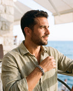 Man wearing the Marco Maveri Titanium Steel Keel Link Bracelet by the sea, Silver