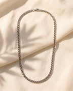 Marco Maveri Titanium Steel Wheat Chain laid on cream linen, Silver
