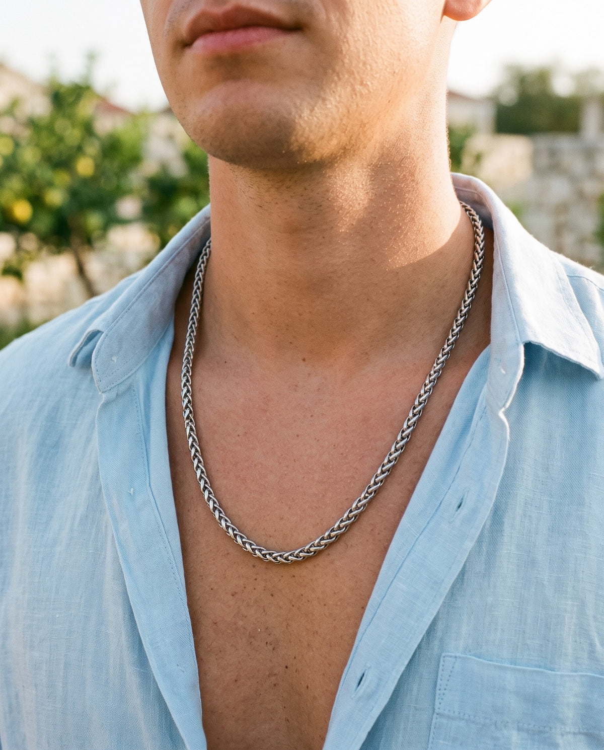 Marco Maveri Titanium Steel Wheat Chain worn with a linen shirt, close-up, Silver