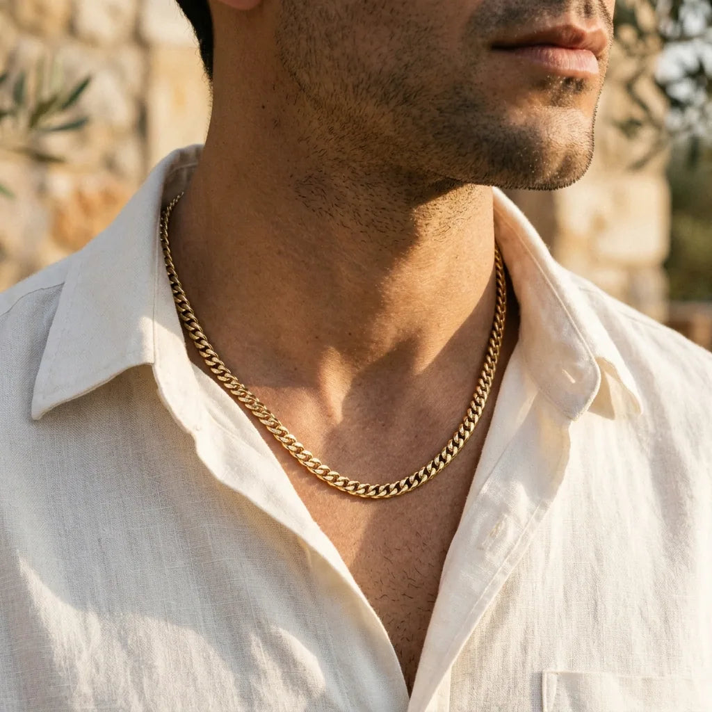 Close-up of a man wearing a polished 18k gold Cuban link chain — Marco Maveri Italian design