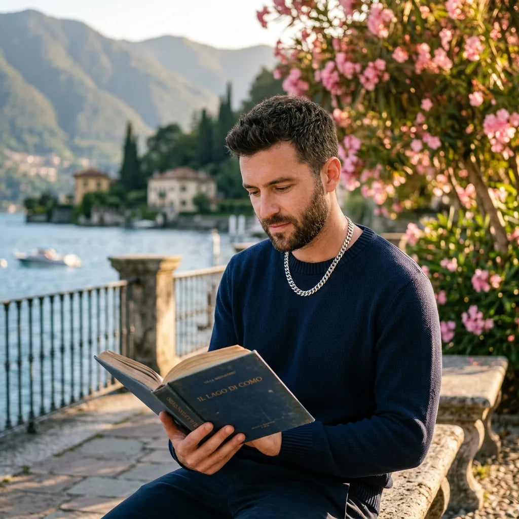 Man with silver chain reading Lake Como